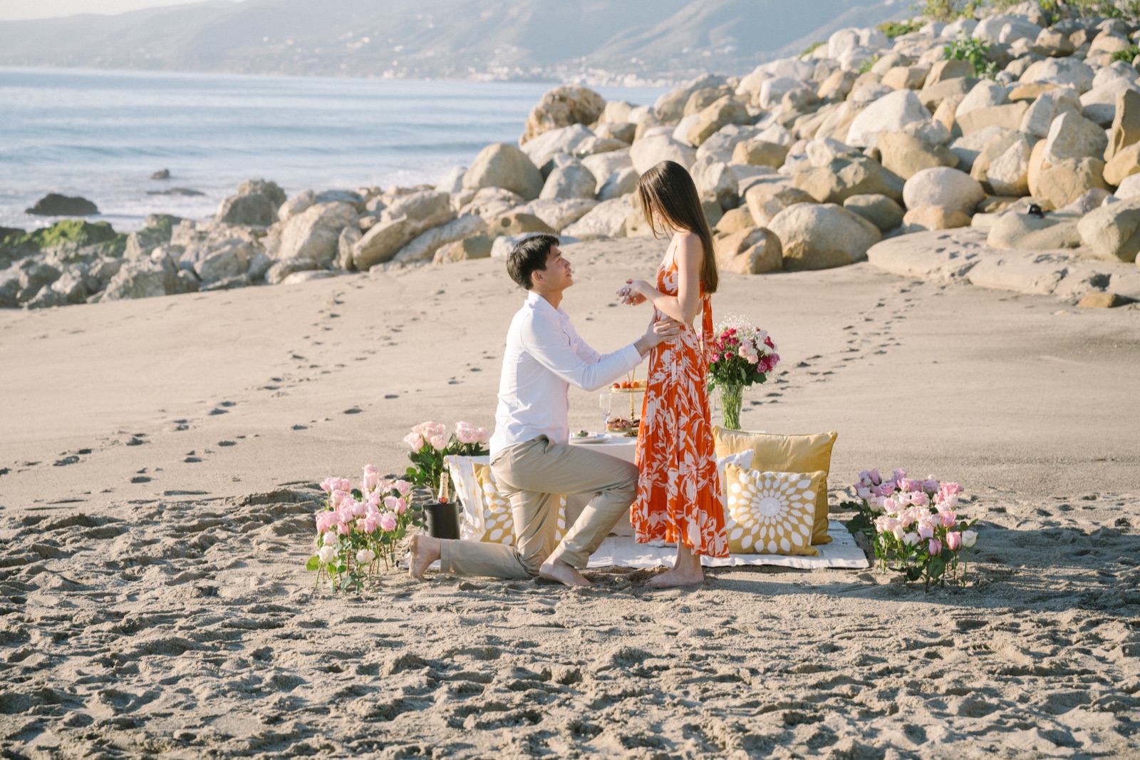 Jonathan proposing to Courtney on the beach at Point Dume